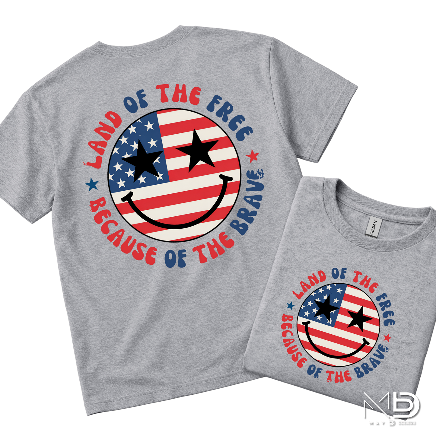 Land of the Free Because of the Braves Patriotic Smiley Face Shirt | American Flag Happy Face Tee | Fourth of July Graphic T-Shirt | USA Independence Day Shirt